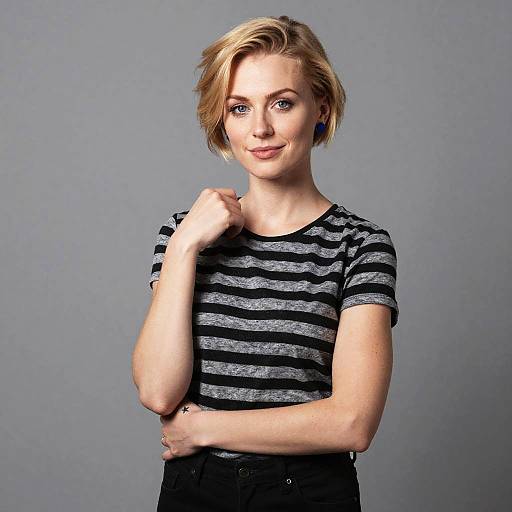Confident Blonde Woman in Striped T-Shirt Studio Portrait