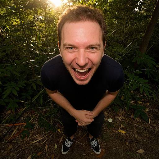Joyful Man Laughing in Forest with Sunlight