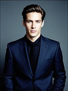 Young Man in Navy Blue Suit and Black Shirt Portrait