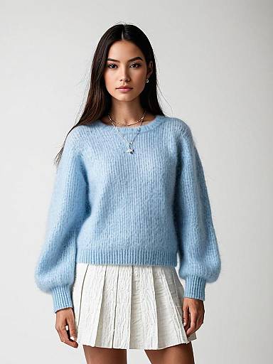 Minimalist Chic Woman Wearing Powder Blue Mohair Sweater with Crew Neck and White Pleated Skirt
