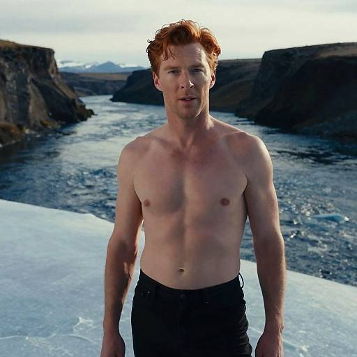 Shirtless Red-Haired Man Near River in Arctic Landscape