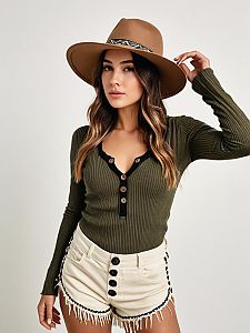 Woman Wearing Olive Green Ribbed Knit Henley Top with Deep V Neckline and Cream High-Waisted Shorts