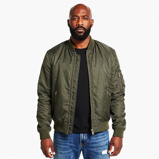 Man Wearing Olive Green Bomber Jacket and Blue Jeans Casual Fashion