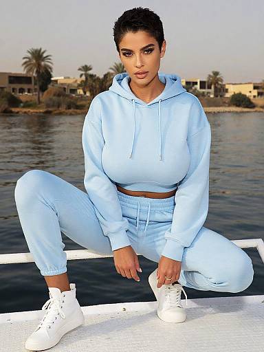 Woman in Pastel Blue Hoodie and Sweatpants Casual Sporty Outfit by the Water