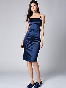 Elegant Navy Blue Satin Midi Dress on Woman in Minimalist Studio