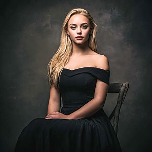 Glamorous Portrait of Woman in Black Gown