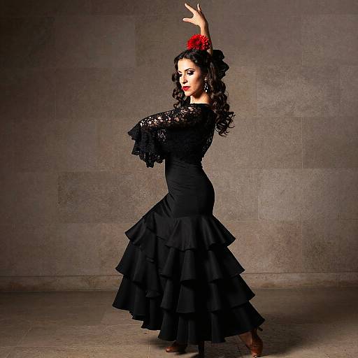 Woman Dancing Flamenco in Traditional Black Lace Dress with Red Flower