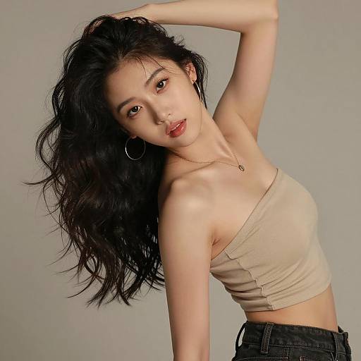 Stylish Gen Z Woman Posing in Beige Tube Top and Black Jeans