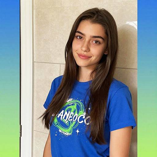 Young Woman Wearing Blue Space-Themed Graphic T-Shirt Indoors