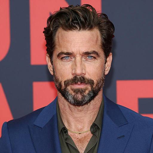 Confident Man in Blue Blazer with Beard and Blue Eyes