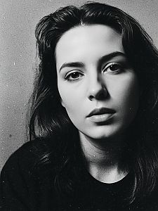 Black and White Close-Up Portrait of Woman with Dark Hair