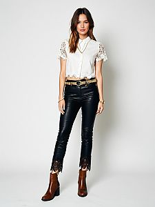 Chic Woman Wearing White Lace Blouse and Black Leather Pants with Brown Ankle Boots