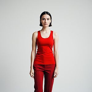 Young woman in red outfit against grey background