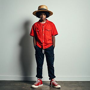 Young Man in Red Shirt and Straw Hat