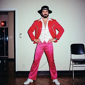 Confident Man in Retro Disco Outfit