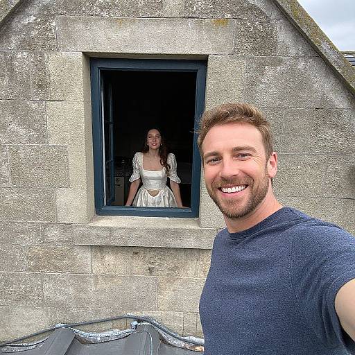 Man Taking Selfie with Woman in Vintage Dress at Stone Building Window