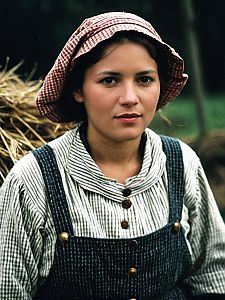 Young Woman in Traditional Peasant Clothing with Checkered Bonnet