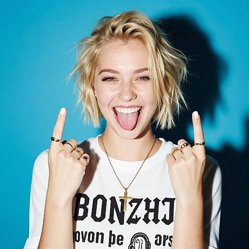 Playful Blonde Woman Showing Middle Fingers Against Blue Background