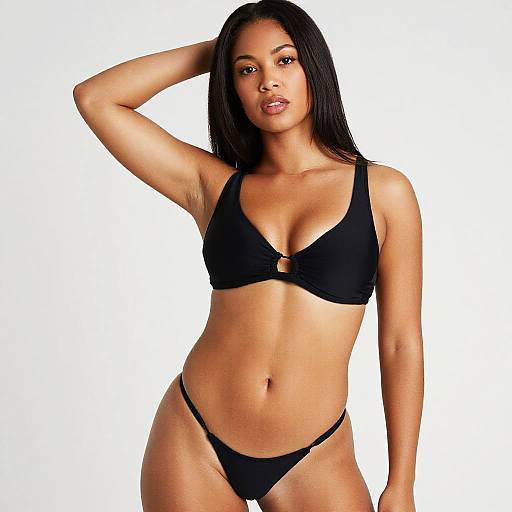 Confident Woman Wearing Black Minimalist Bikini in Studio