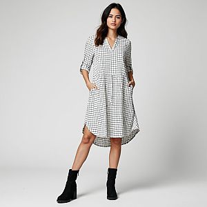 Stylish Woman in White Shirtdress with Black Grid Pattern