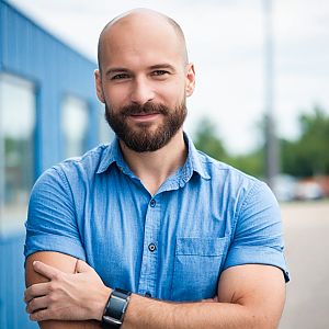 Confident bald man in casual urban setting