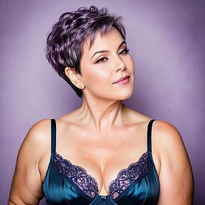 Confident Woman with Purple Hair in Teal Top