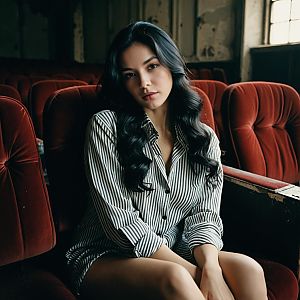 Thoughtful Woman in Vintage Theater