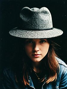 Close-Up Portrait of Woman Wearing Gray Fedora Hat with Denim Jacket