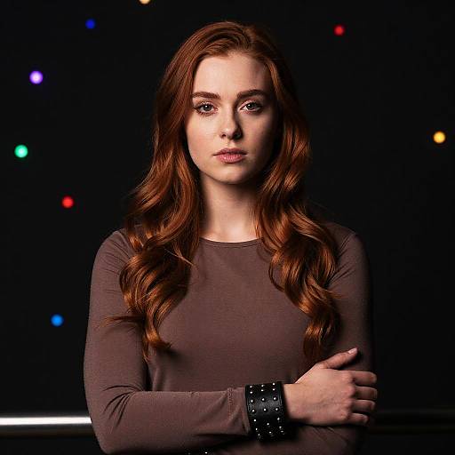 Confident Redhead Woman in Stylish Taupe Top with Studded Bracelet