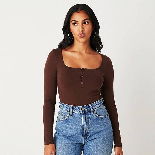 Young Woman in Brown Top and High-Waisted Blue Jeans