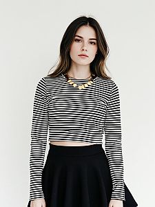 Woman in Modern Casual Striped Cropped Long Sleeve Top and Black Skirt