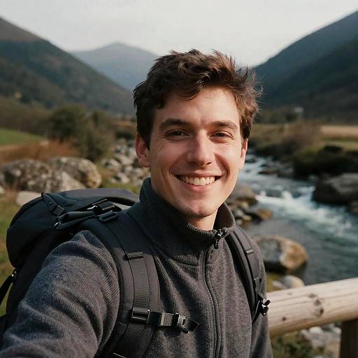 Young Man Hiking Selfie in Mountainous River Landscape