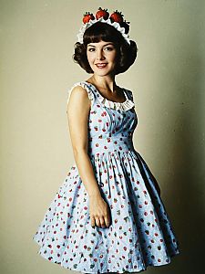 Vintage Woman in Strawberry Pattern Dress with Strawberry Headpiece