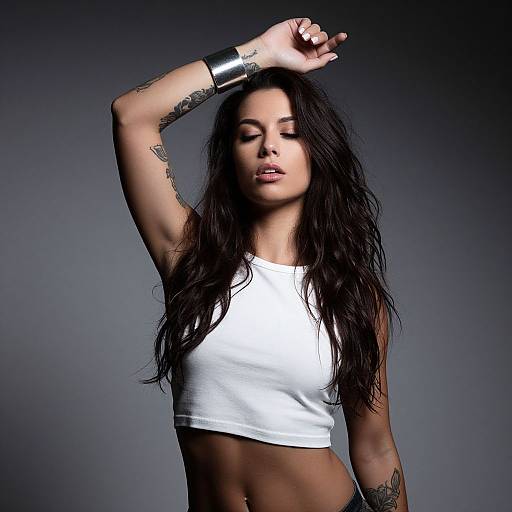 Confident Woman Posing with Tattoos and White Crop Top