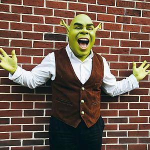 Man in Green Mask with Exaggerated Features
