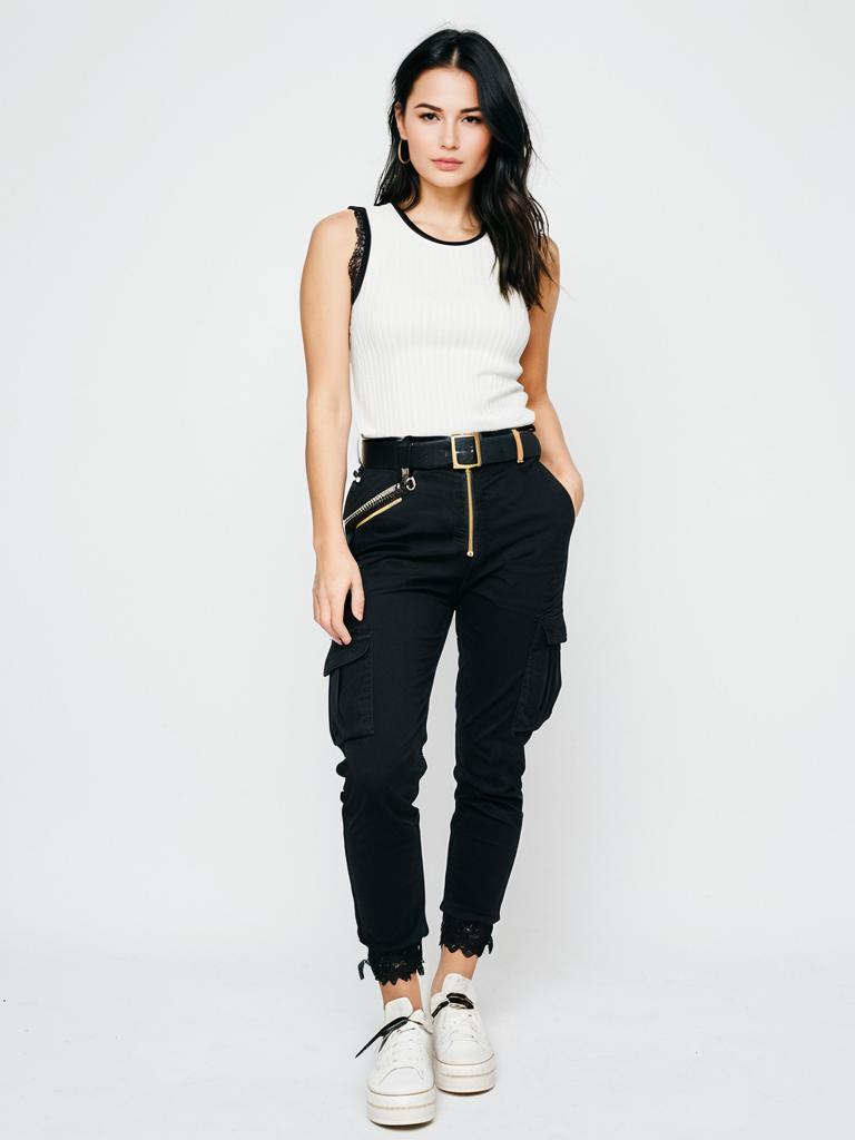 Stylish Woman in White Sleeveless Top and Black Cargo Pants Standing Confidently