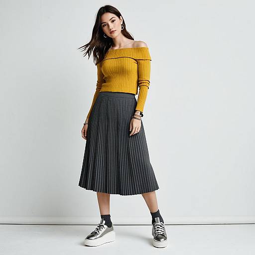 Stylish Woman in Mustard Sweater and Pleated Gray Skirt Fashion Outfit