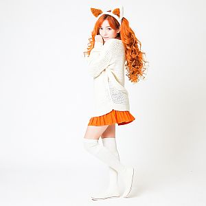 Young Woman with Orange Hair in Whimsical Fashion