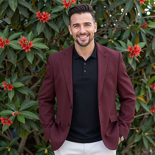 Smiling Man Wearing Burgundy Blazer and Black Polo Outdoors