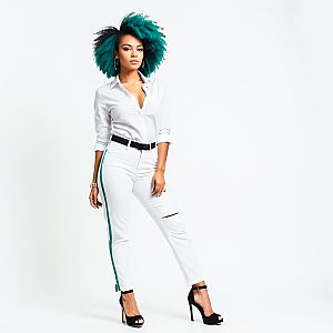 Confident Woman in All-White Outfit with Teal Afro