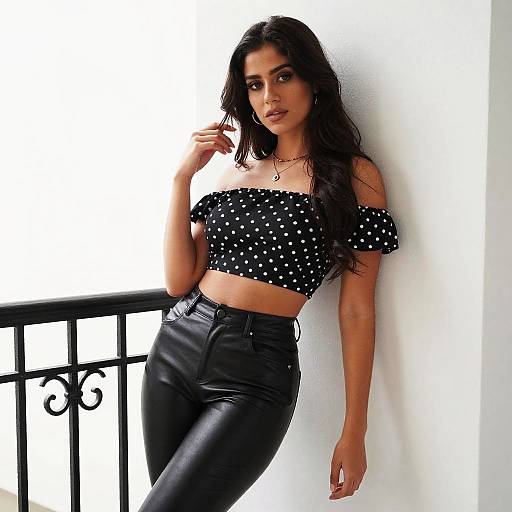 Confident Woman in Polka Dot Crop Top and Black Leather Pants