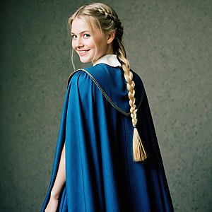 Smiling Woman in Blue Cape