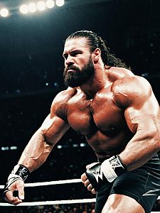 Muscular WWE Fighter in Action with Beard and Long Hair
