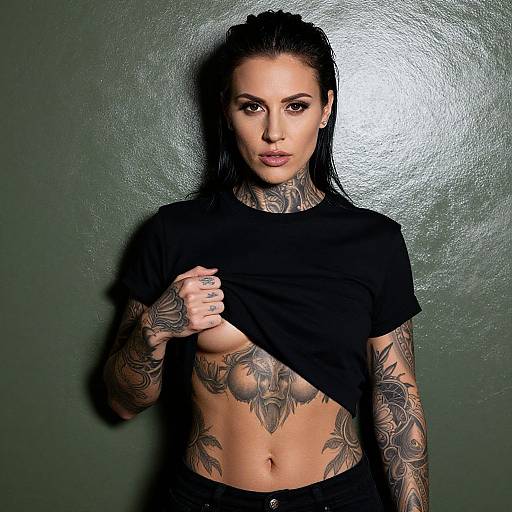 Tattooed Woman Lifting Shirt Showing Stomach Tattoos