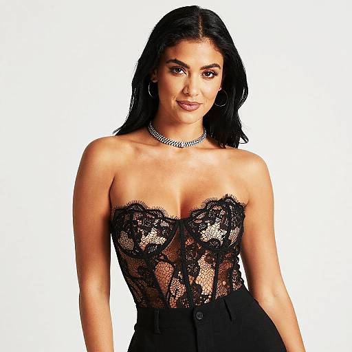 Elegant Woman Wearing Black Lace Corset Top and High-Waisted Trousers