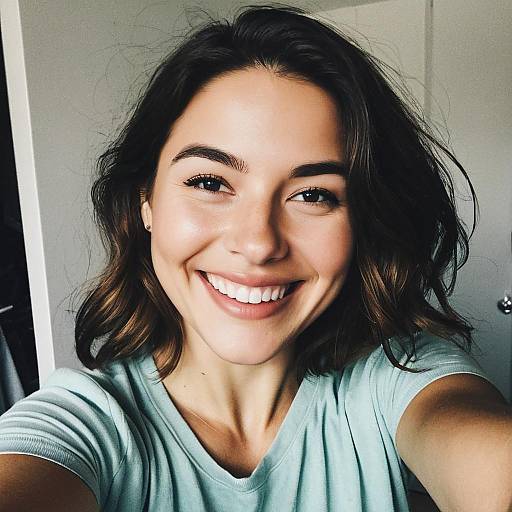 Smiling Young Woman Taking a Selfie in Casual Light Green T-Shirt