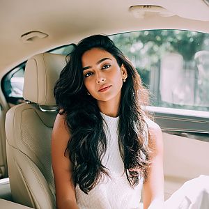 Elegant Young Woman in Car