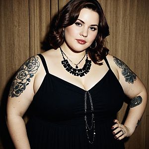 Confident Plus-Size Woman in Black Dress with Floral Tattoos