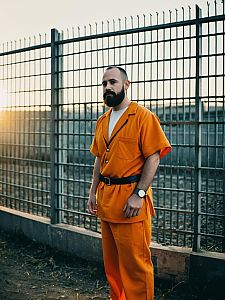 Man in Orange Prison Costume Outdoor Photorealistic Cosplay Photo