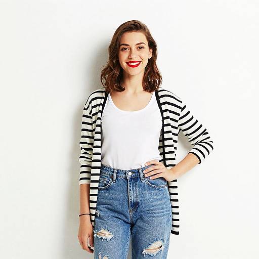 Confident Young Woman in Striped Cardigan and Distressed Jeans